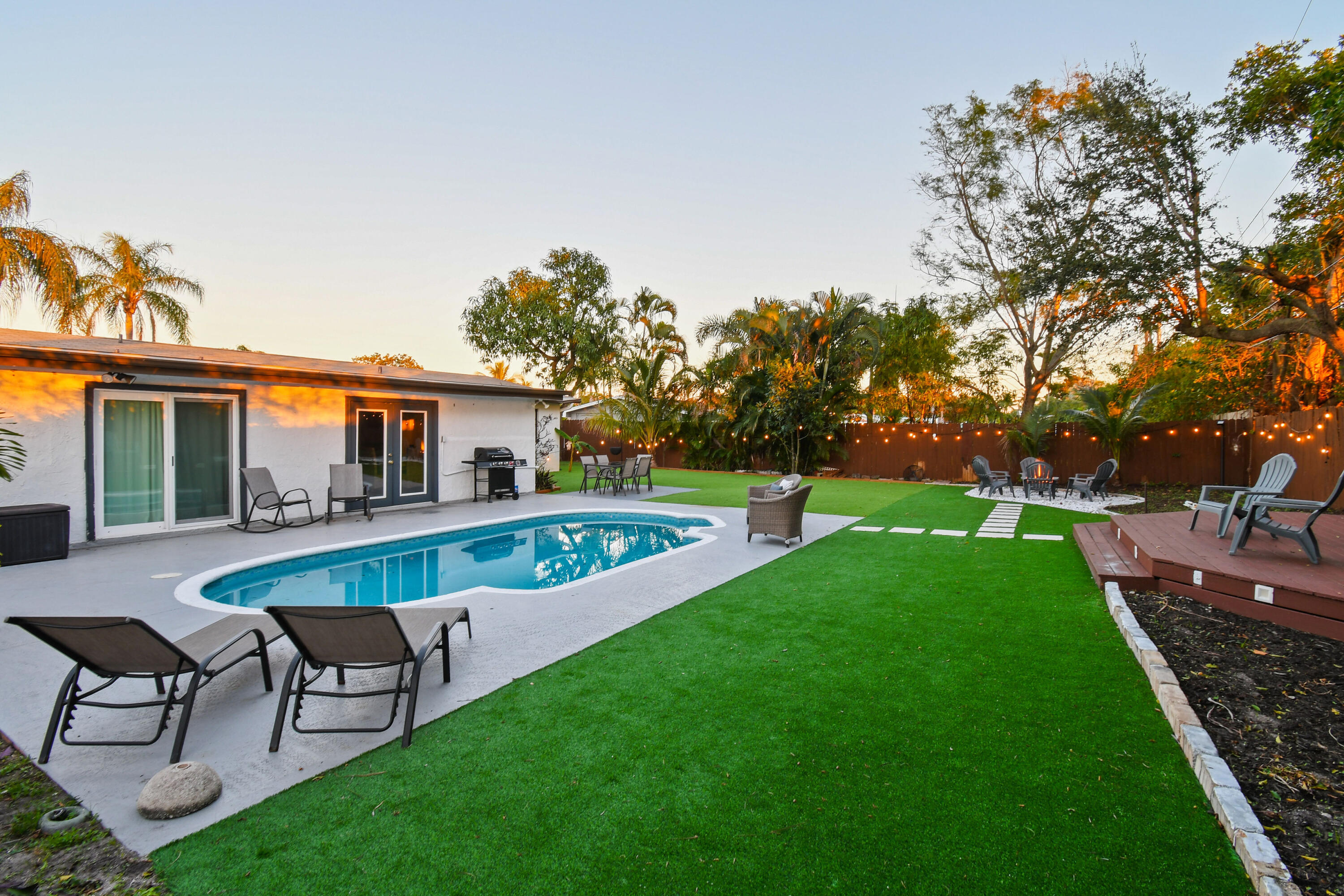 973 Laurel Road North Palm Beach, FL 33408 - Photo 49 of 57 a view of a house with a yard and sitting area