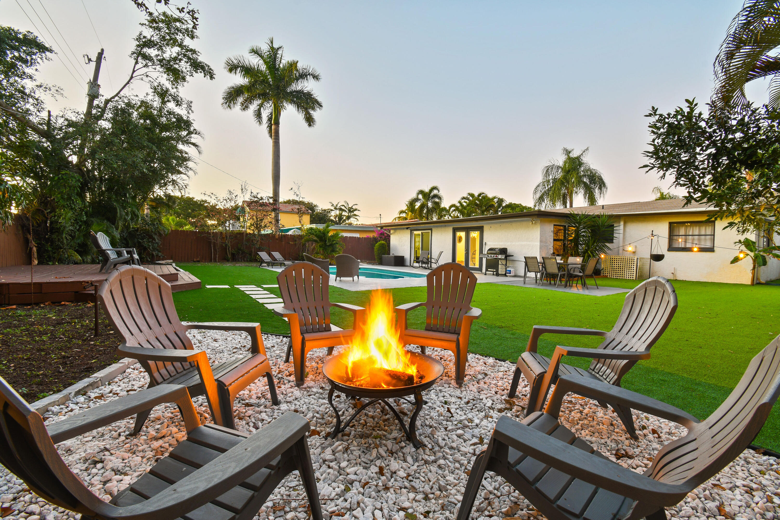973 Laurel Road North Palm Beach, FL 33408 - Photo 50 of 57 a view of a swimming pool with a lounge chairs
