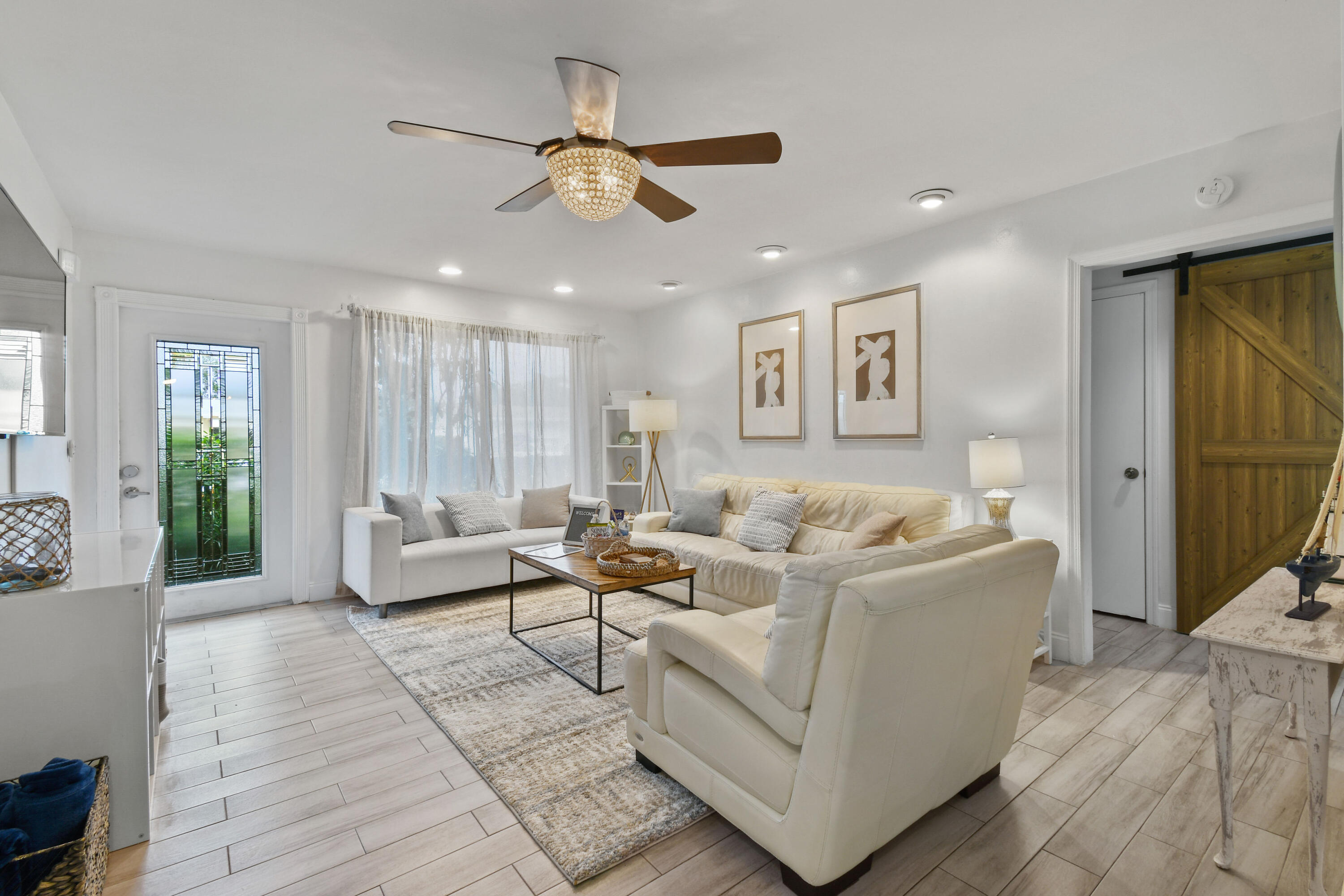 973 Laurel Road North Palm Beach, FL 33408 - Photo 10 of 57 a living room with furniture and a large window