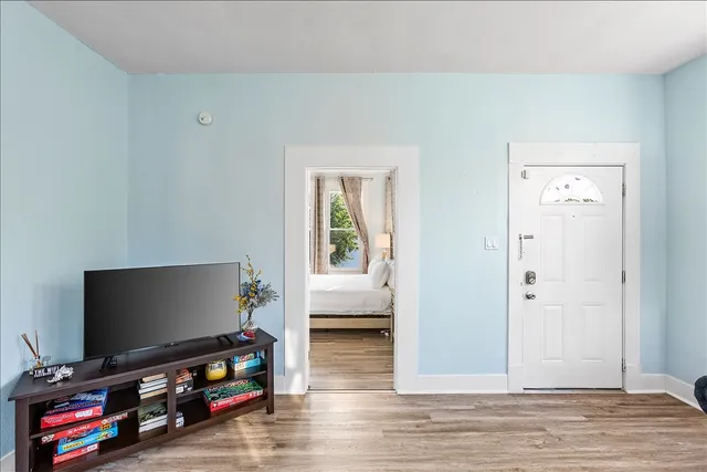 a living room with furniture and a flat screen tv