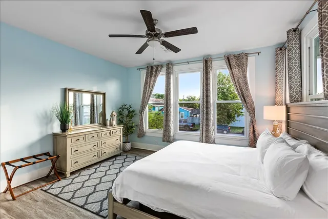 a bed room with a bed and a large window