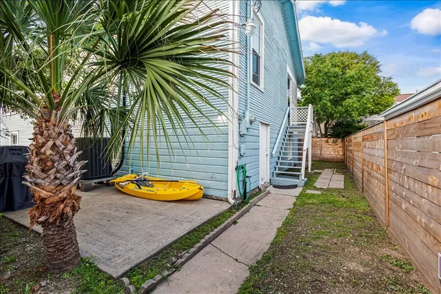 a view of backyard with a patio