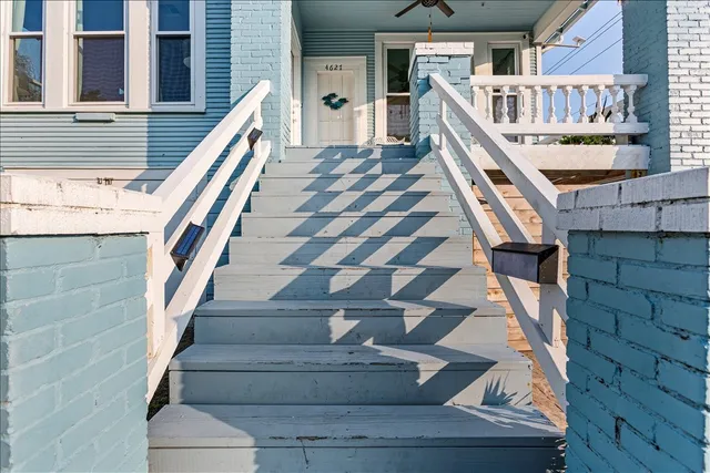 a view of entryway with wooden floor and stairs