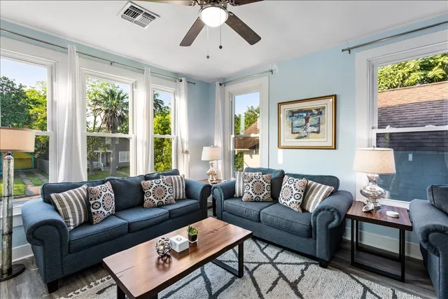 a living room with furniture and a large window