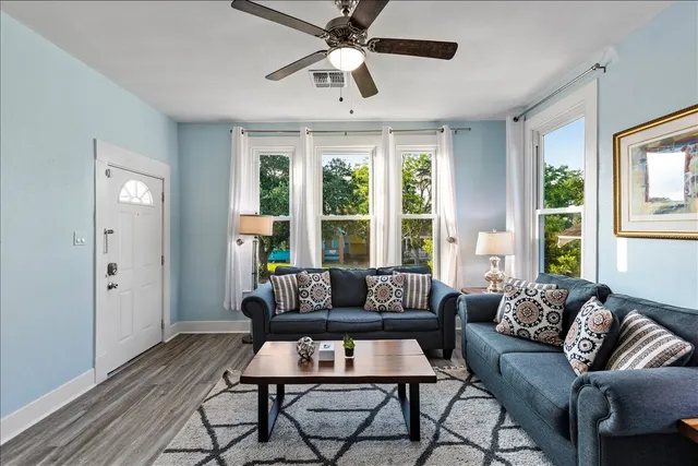 a living room with furniture and a large window