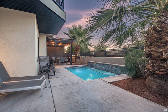 2600 Ocotillo Way, Unit 31 Santa Clara, UT 84765 - Photo 40 of 73 Concrete patio featuring a compact swimming pool with stone-clad waterfall and integrated spa