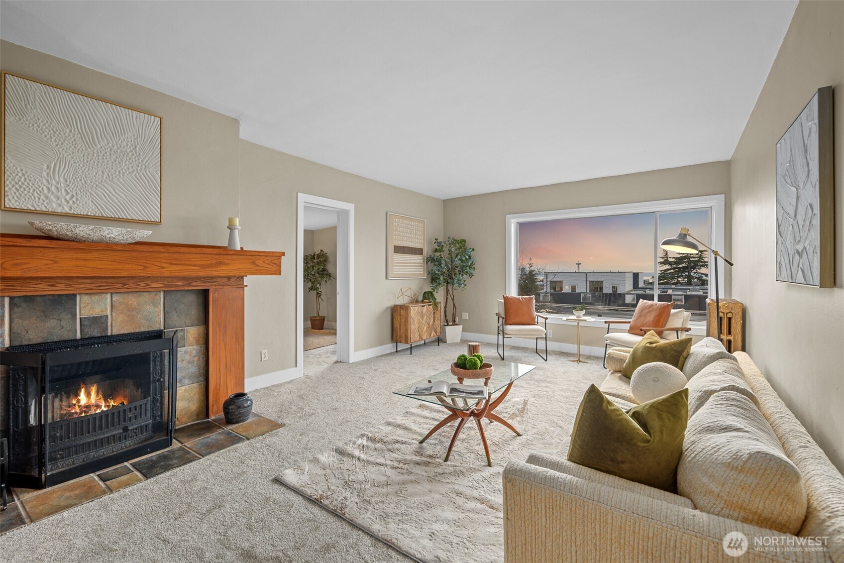 a living room with furniture and a fireplace