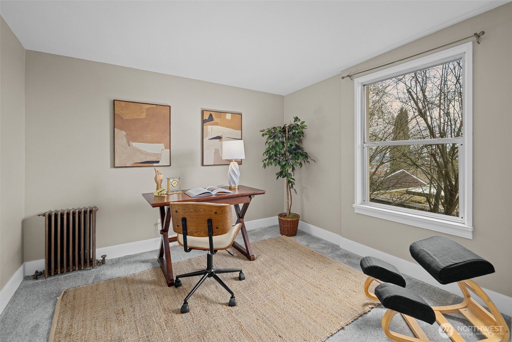 630 13th Avenue East, Unit 3 Seattle, WA 98102 - Photo 11 of 22 a view of a workspace with furniture and a window