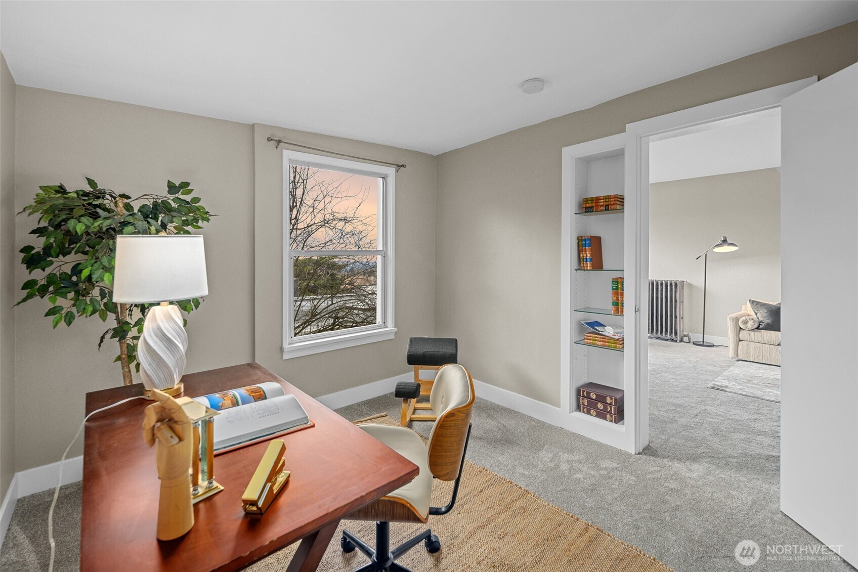 630 13th Avenue East, Unit 3 Seattle, WA 98102 - Photo 12 of 22 a workspace with furniture and a potted plant