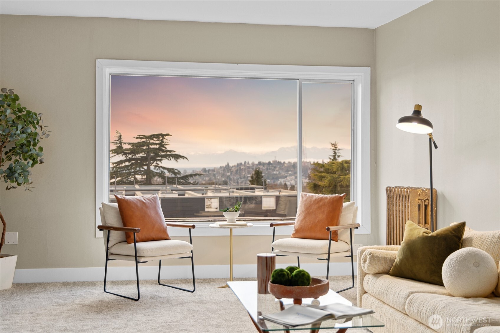 630 13th Avenue East, Unit 3 Seattle, WA 98102 - Photo 2 of 22 a living room with patio furniture and a floor to ceiling window