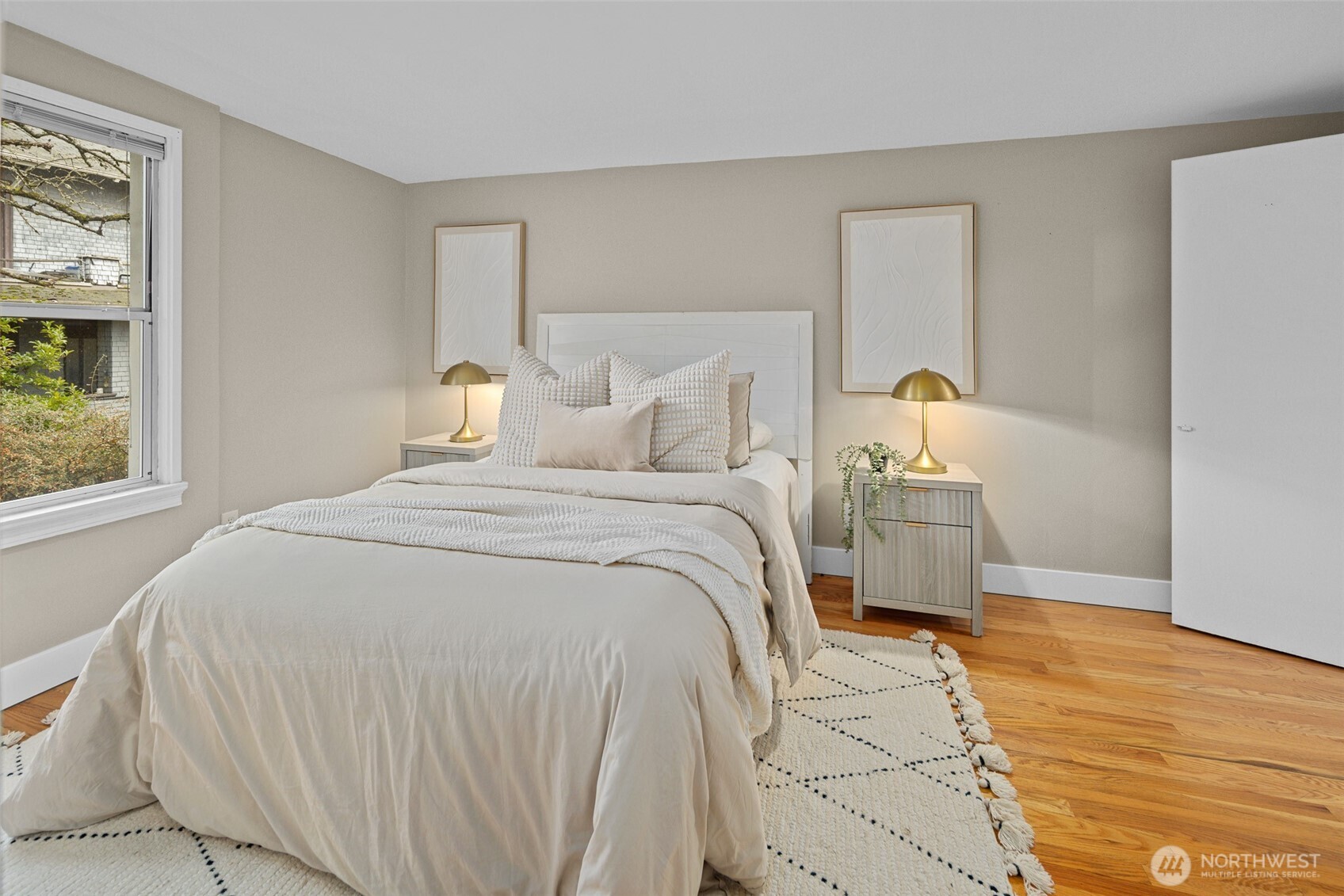 630 13th Avenue East, Unit 3 Seattle, WA 98102 - Photo 8 of 22 a bedroom with a bed and a window