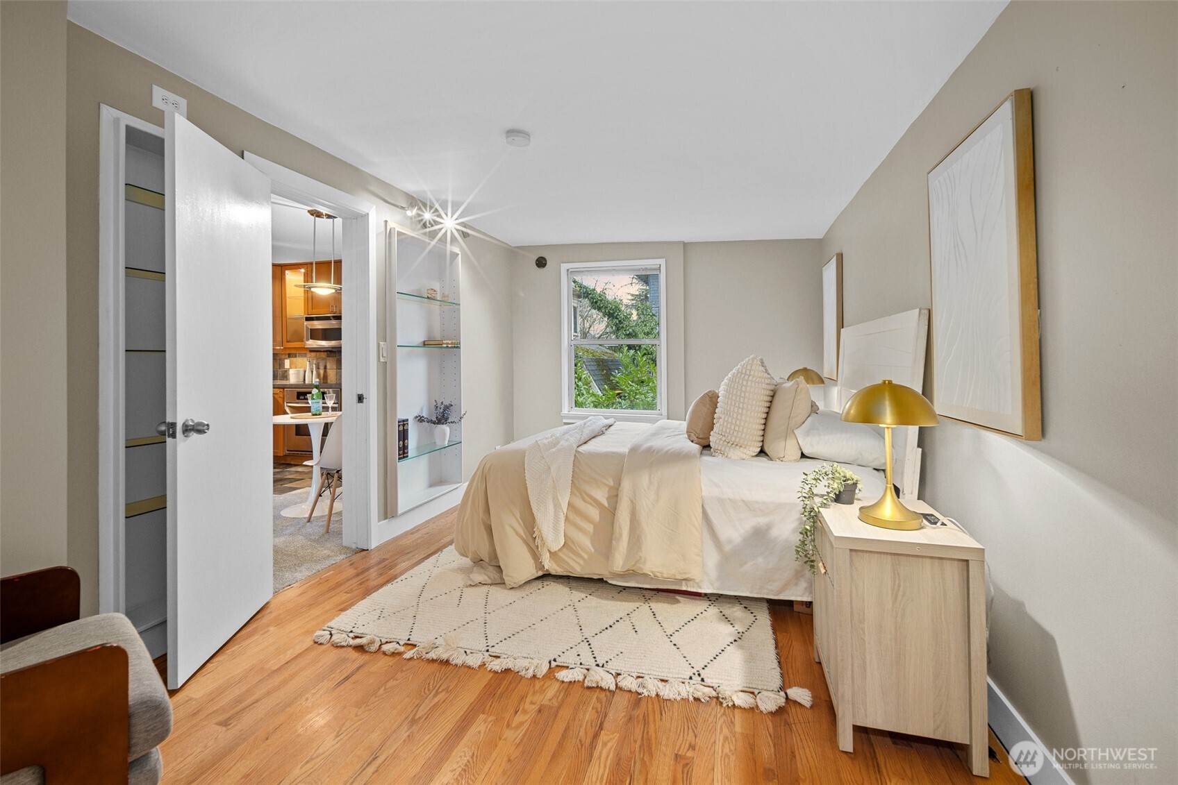 630 13th Avenue East, Unit 3 Seattle, WA 98102 - Photo 9 of 22 a bedroom with a bed and wooden floor