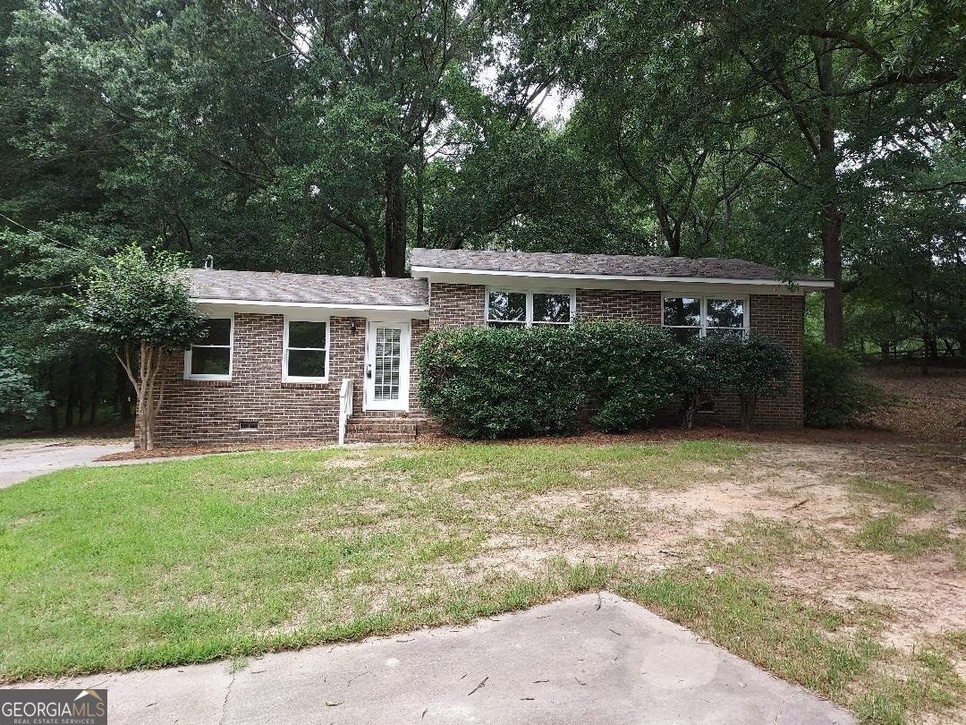 4940 Sandy Creek Road Madison, GA 30650 - Photo 1 of 1 front view of a house with a yard
