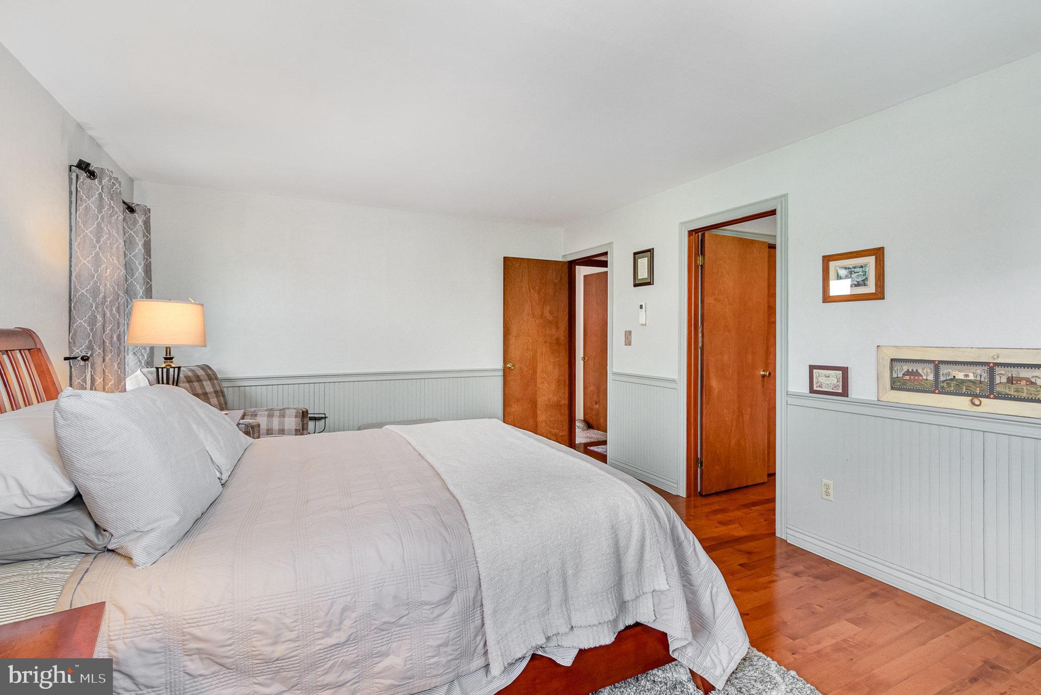 44 Hill Top Road Halifax, PA 17032 - Photo 19 of 40 a bedroom with a bed and painting on the wall