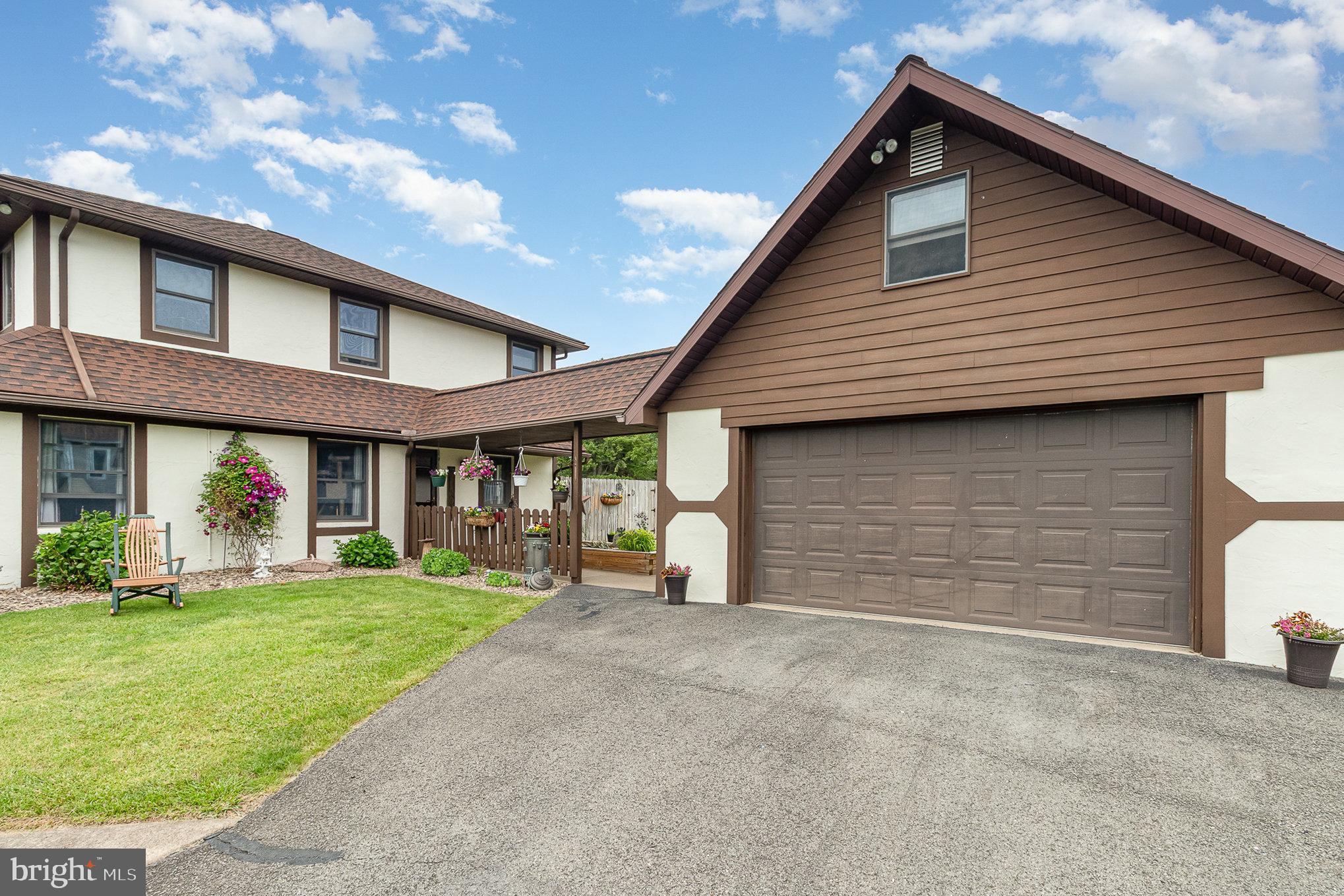 44 Hill Top Road Halifax, PA 17032 - Photo 29 of 40 a front view of a house with a yard and garage