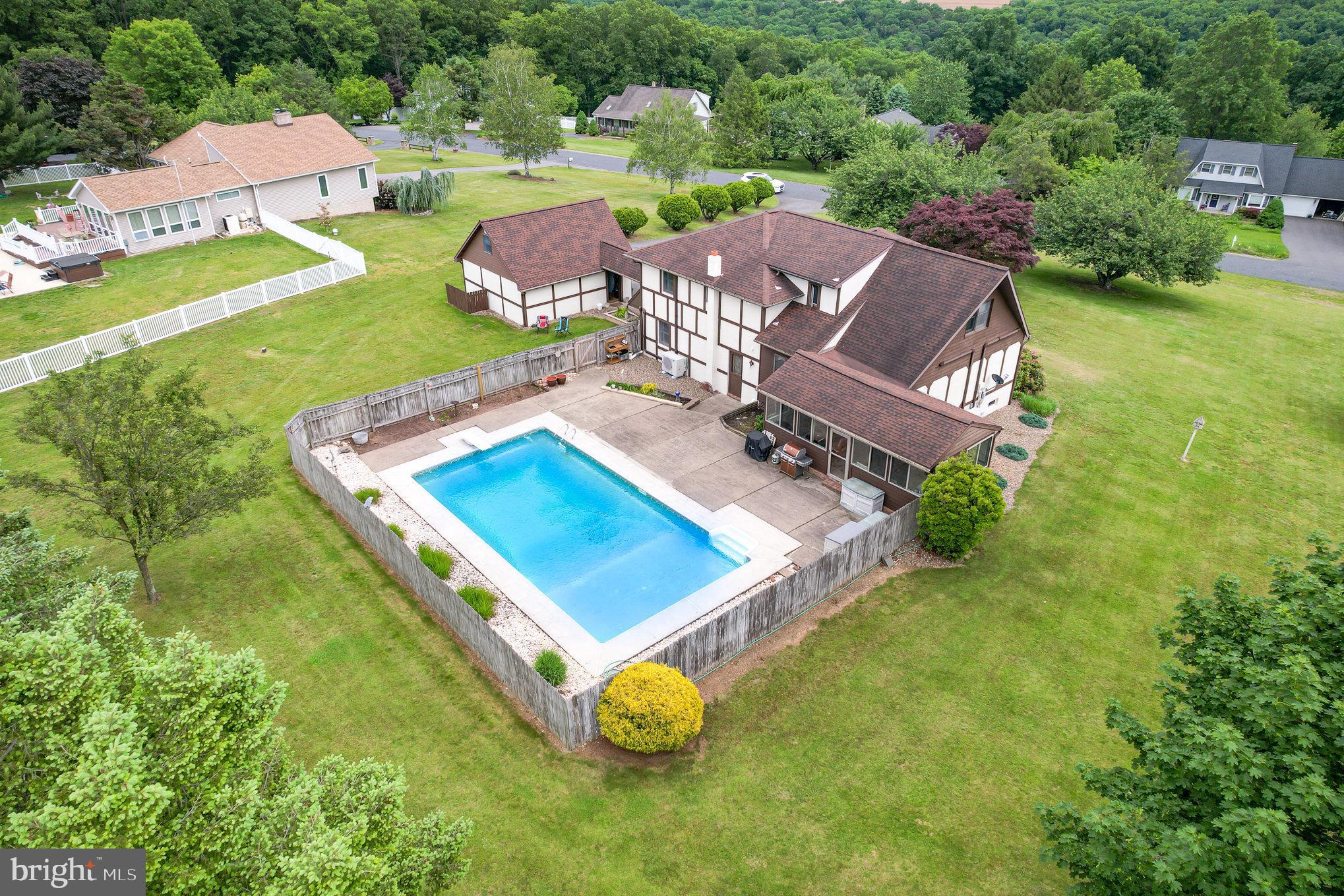 44 Hill Top Road Halifax, PA 17032 - Photo 30 of 40 an aerial view of a house with a garden and swimming pool