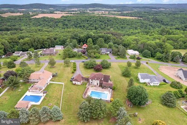an aerial view of a house with a garden