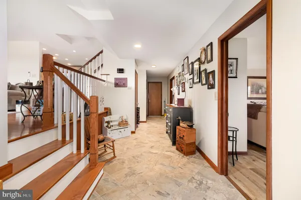a view of a hallway with seating area