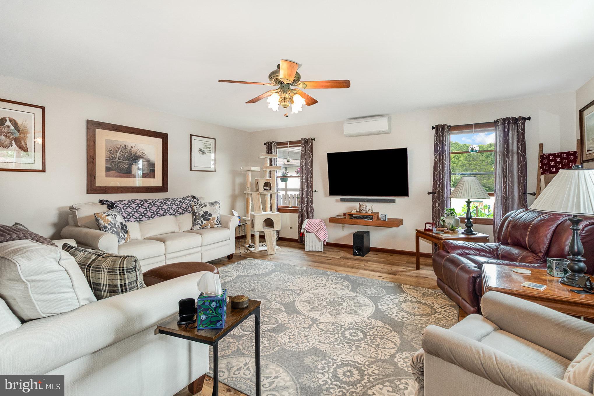 44 Hill Top Road Halifax, PA 17032 - Photo 5 of 40 a living room with furniture and a flat screen tv