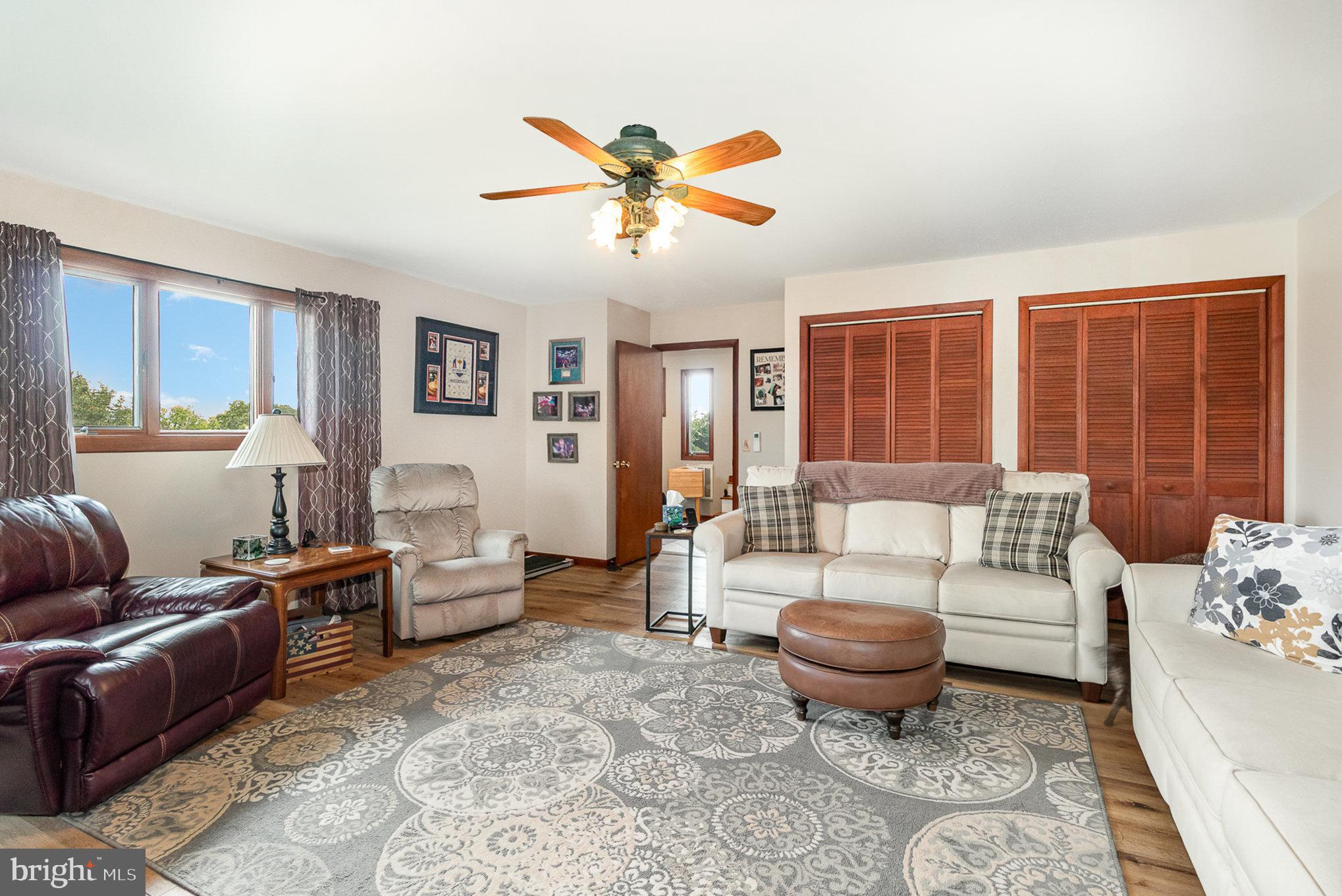44 Hill Top Road Halifax, PA 17032 - Photo 6 of 40 a living room with furniture ceiling fan and a window