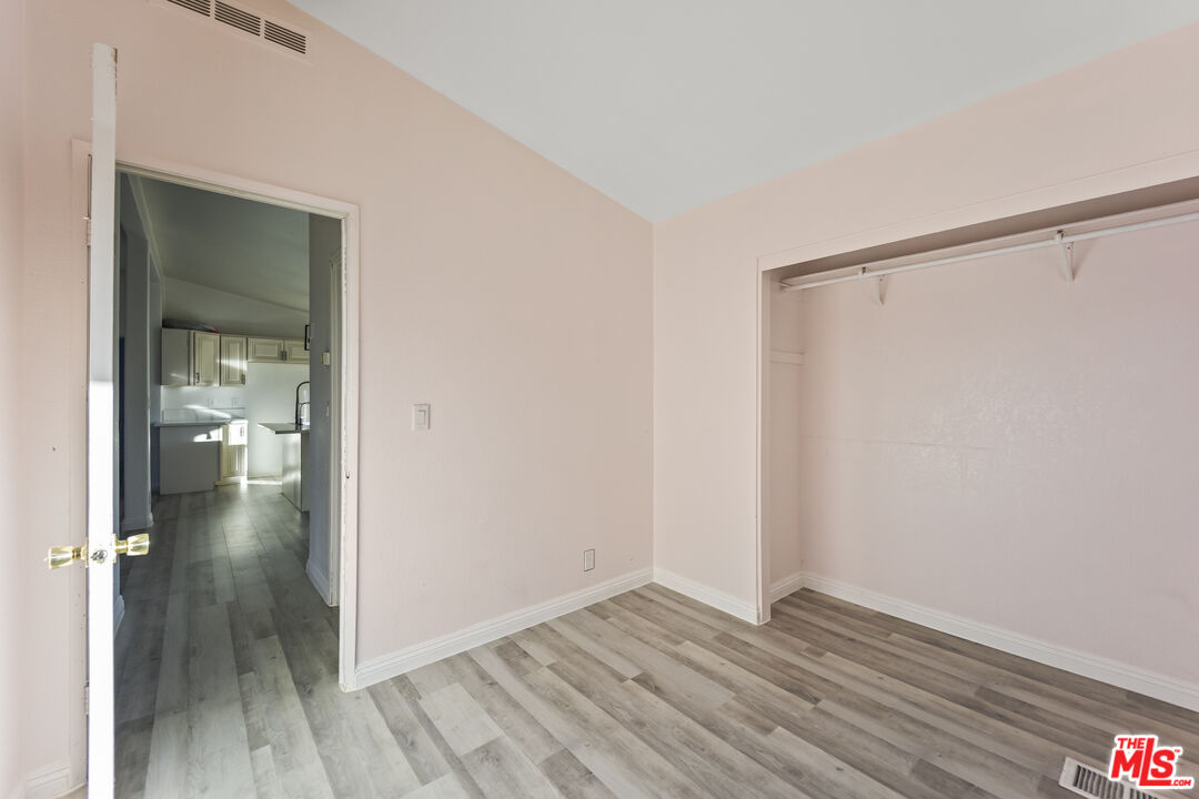 6677 Maricopa Road Phelan, CA 92371 - Photo 12 of 38 wooden floor in an empty room