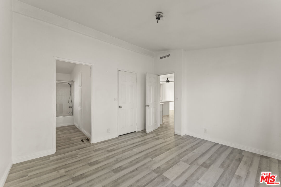 6677 Maricopa Road Phelan, CA 92371 - Photo 15 of 38 a view of an empty room and wooden floor