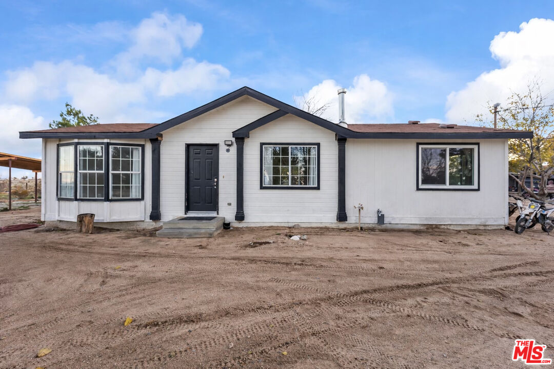 6677 Maricopa Road Phelan, CA 92371 - Photo 2 of 38 a view of a house with a patio
