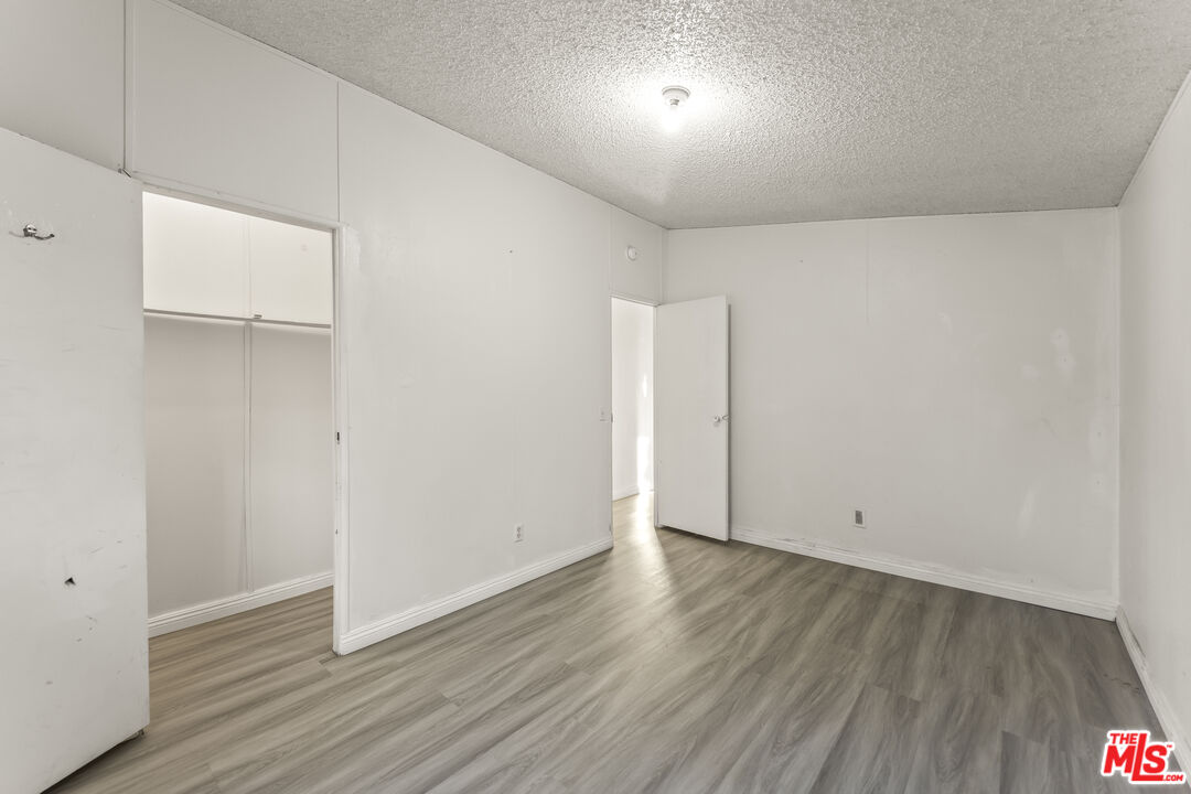 6677 Maricopa Road Phelan, CA 92371 - Photo 29 of 38 a view of an empty room with wooden floor