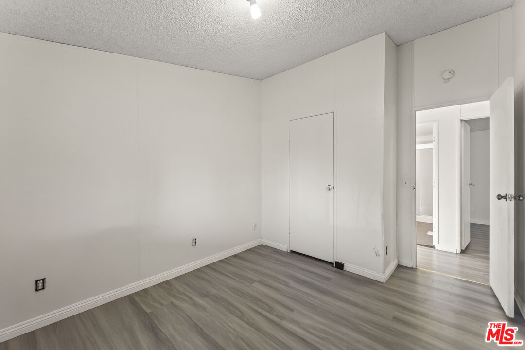 6677 Maricopa Road Phelan, CA 92371 - Photo 32 of 38 a view of a room with wooden floor