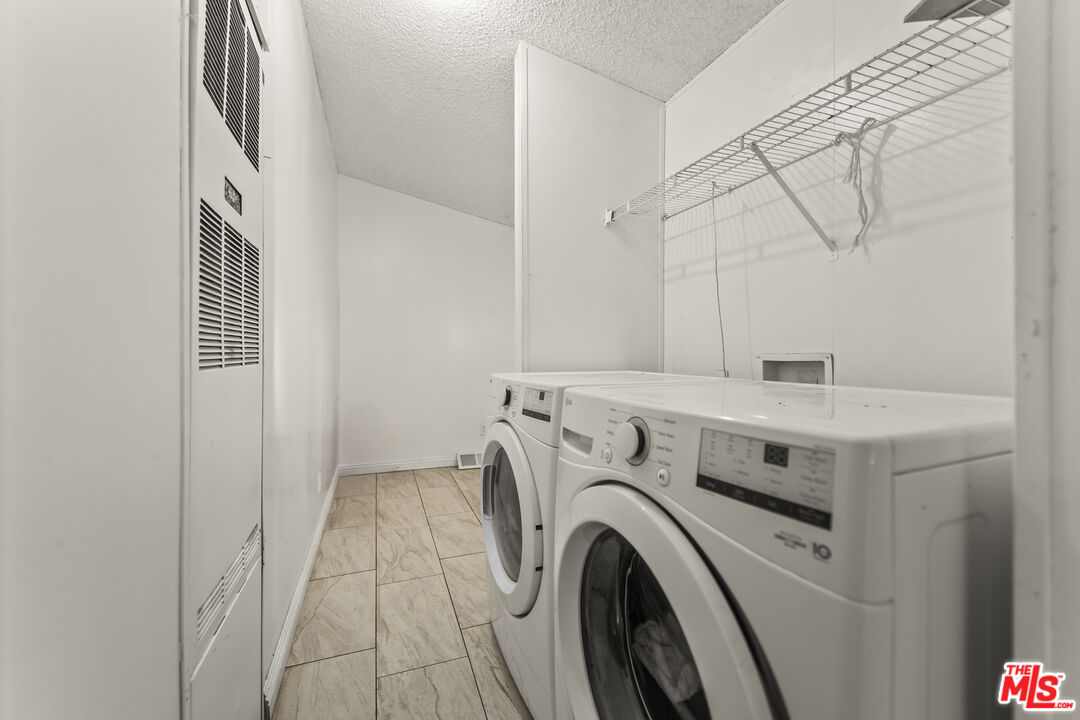 6677 Maricopa Road Phelan, CA 92371 - Photo 33 of 38 a utility room with dryer and washer