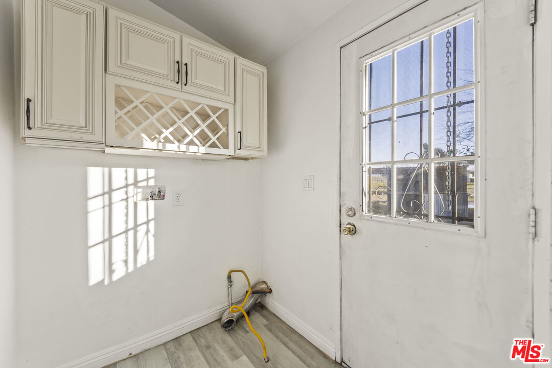 6677 Maricopa Road Phelan, CA 92371 - Photo 9 of 38 a view of an empty room with a window