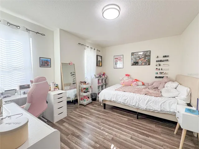 a bedroom with bed and a couch