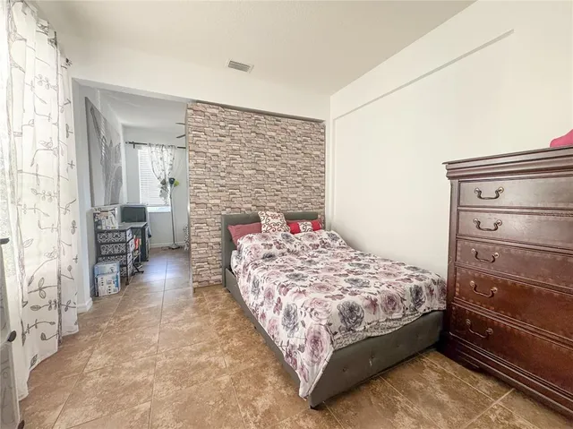 a bedroom with a bed and a cabinets