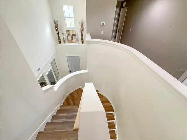 a view of staircase with large window