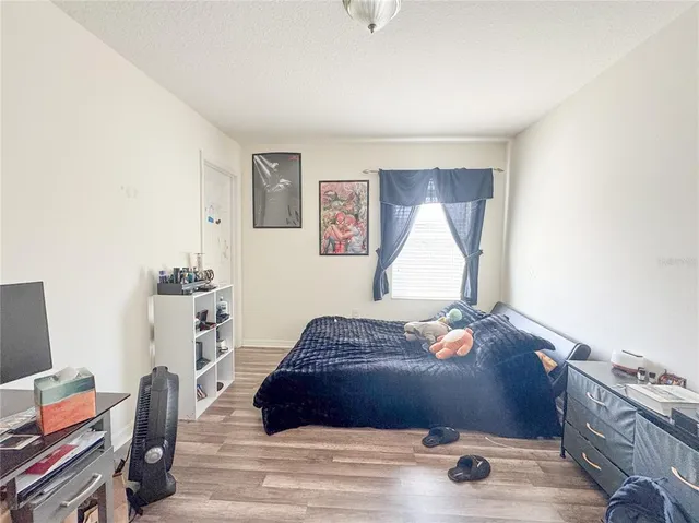 a living room with a couch and a window