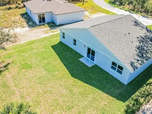 a view of a back yard of the house
