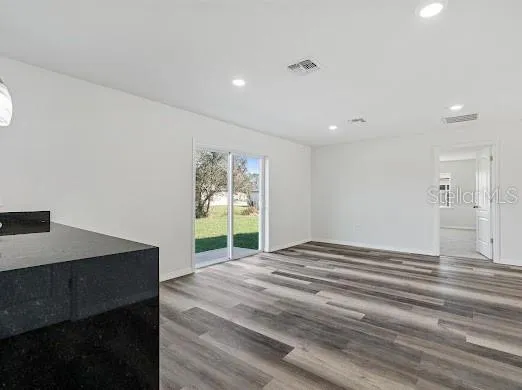 a view of a room with a bed and a table
