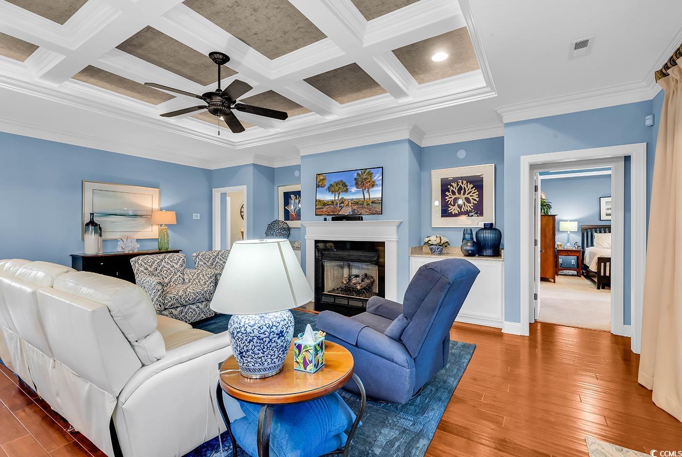956 Corrado Street Myrtle Beach, SC 29572 - Photo 13 of 38 Living room with ornamental molding, a fireplace, beamed ceiling, coffered ceiling, and wood finished floors
