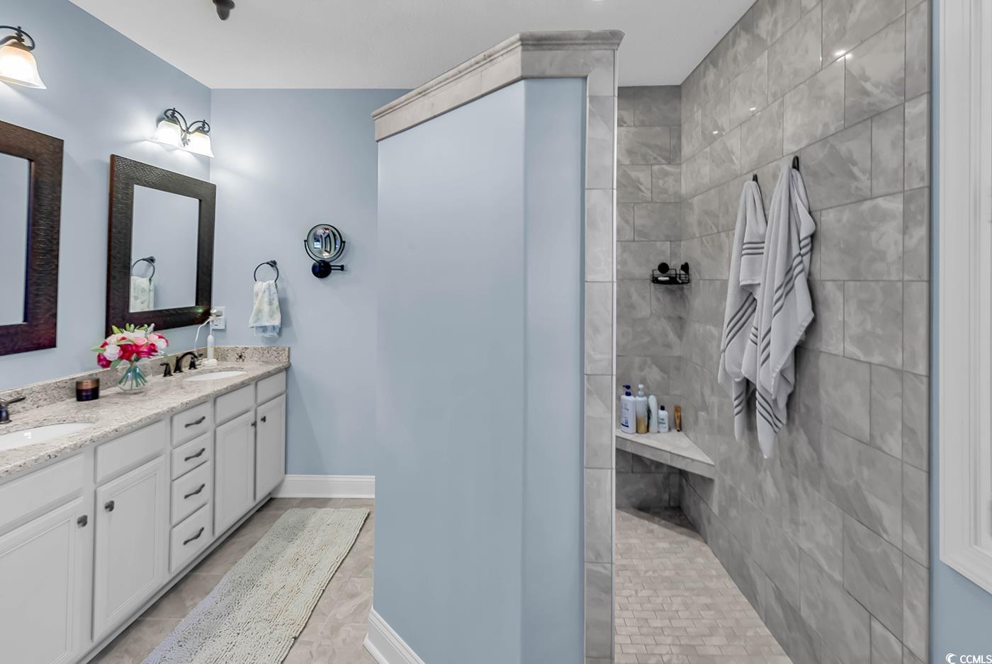 956 Corrado Street Myrtle Beach, SC 29572 - Photo 19 of 38 Bathroom with a walk in shower, double vanity, and light tile patterned floors