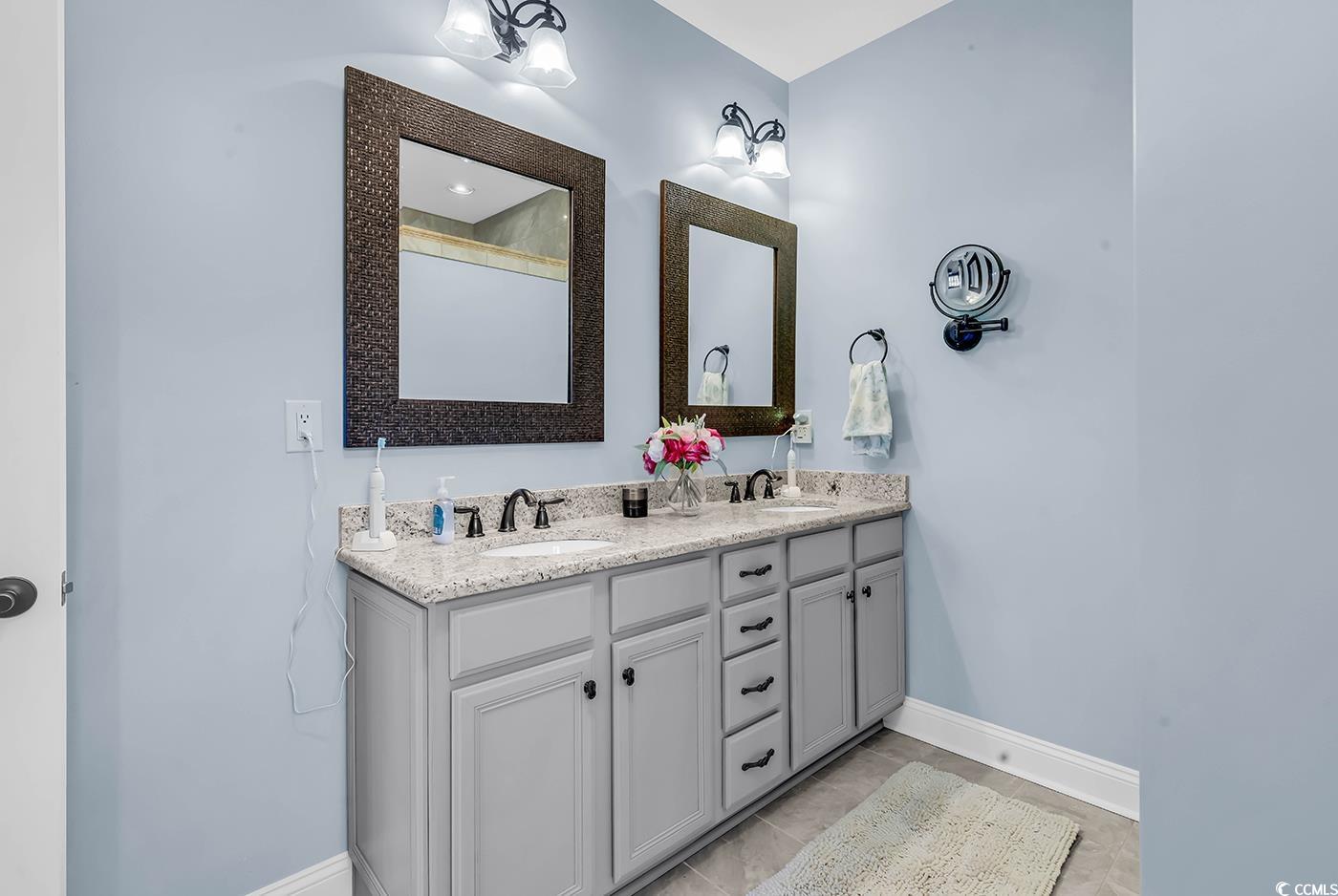956 Corrado Street Myrtle Beach, SC 29572 - Photo 21 of 38 Full bathroom featuring double vanity and baseboards