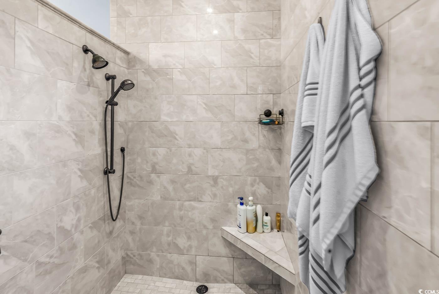 956 Corrado Street Myrtle Beach, SC 29572 - Photo 22 of 38 Bathroom featuring a tile shower and a towel warmer
