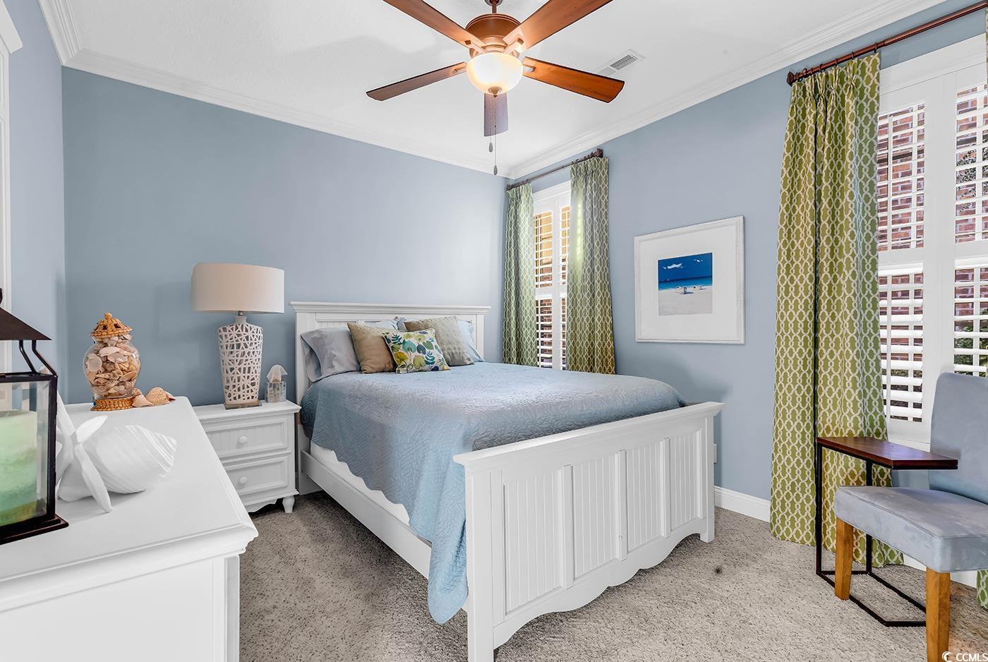 956 Corrado Street Myrtle Beach, SC 29572 - Photo 23 of 38 Bedroom featuring light colored carpet, crown molding, and a ceiling fan