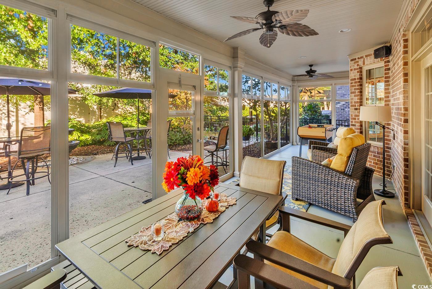 956 Corrado Street Myrtle Beach, SC 29572 - Photo 30 of 38 Sunroom / solarium with outdoor dining space and ceiling fan