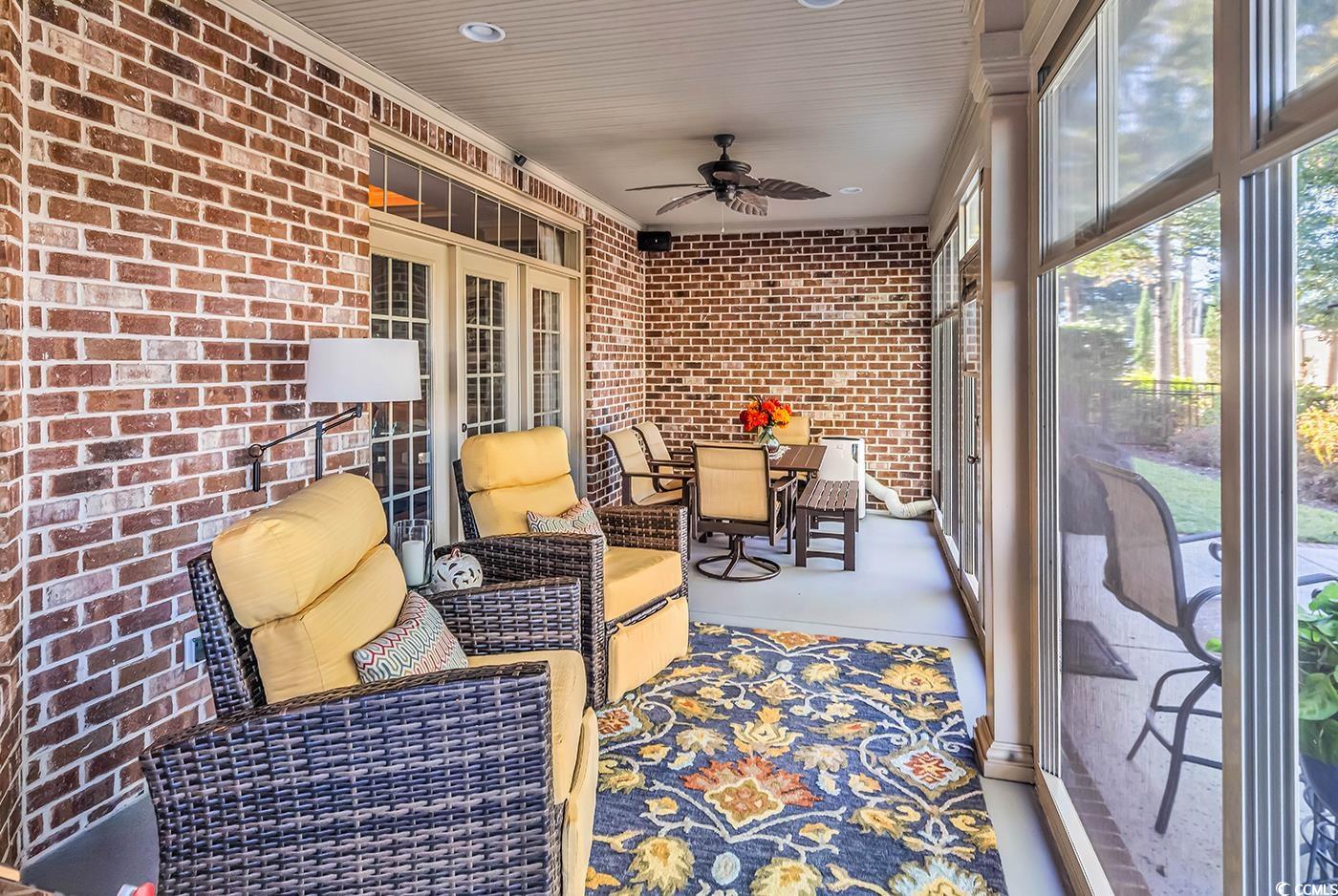 956 Corrado Street Myrtle Beach, SC 29572 - Photo 31 of 38 Sunroom / solarium with a ceiling fan and outdoor dining space