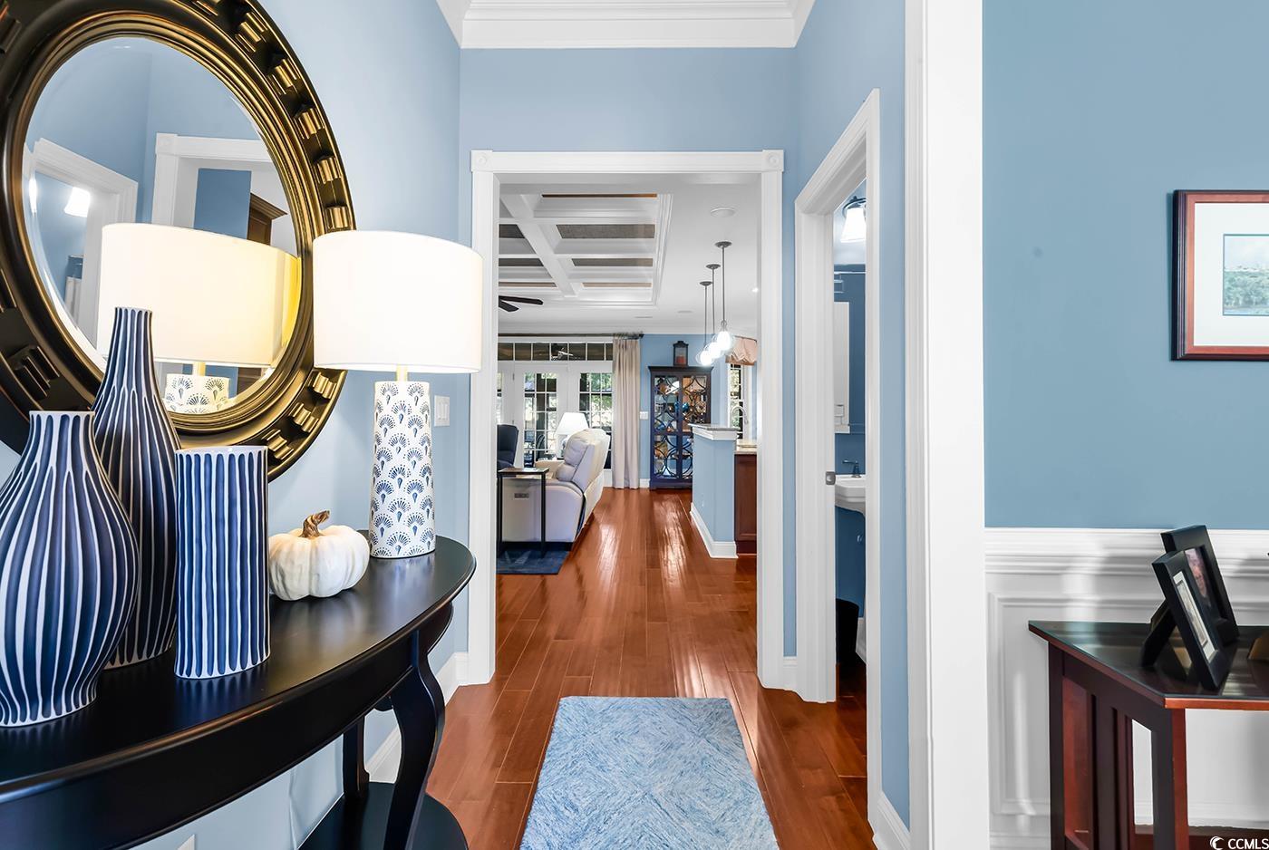 956 Corrado Street Myrtle Beach, SC 29572 - Photo 5 of 38 Hallway featuring coffered ceiling, dark wood-type flooring, crown molding, and beam ceiling