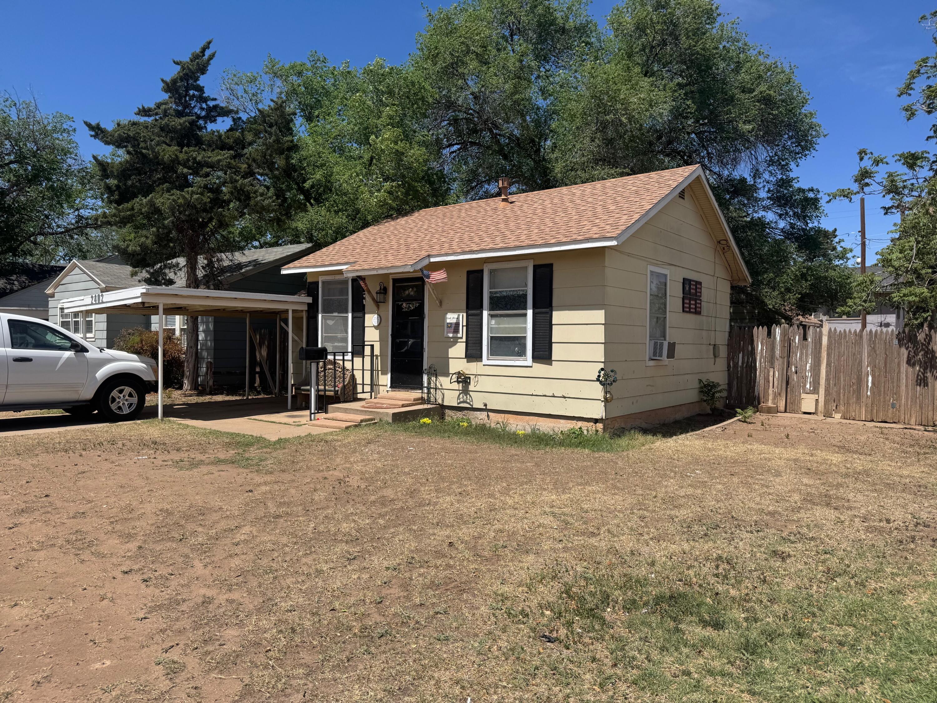 2402 25th Street Lubbock, TX 79411 - Photo 1 of 3 a house with trees in the background