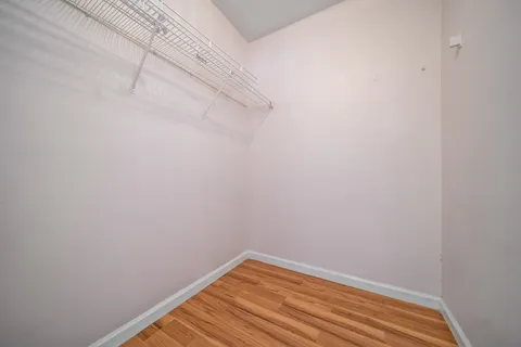 a view of a small space with racks on the wall