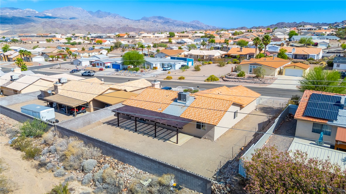 2524 South Ridge Avenue Bullhead City, AZ 86429 - Photo 57 of 64 Aerial perspective of suburban area featuring a mountainous background