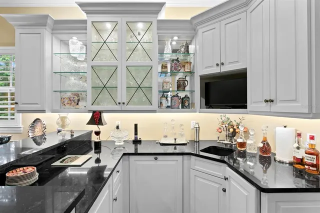 a kitchen with a sink stove and microwave