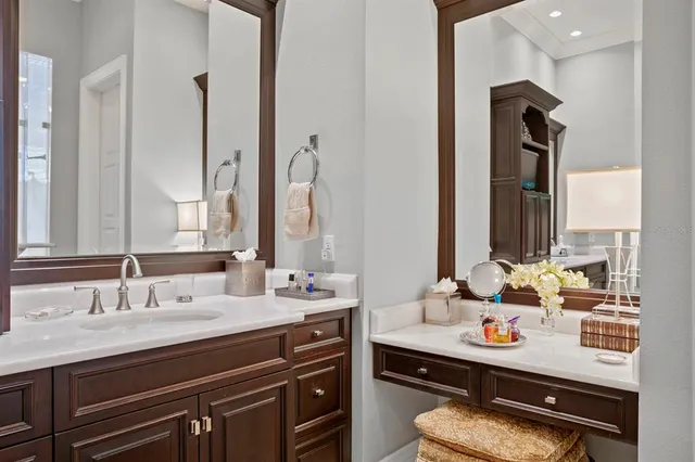 a bathroom with a sink double vanity and a mirror